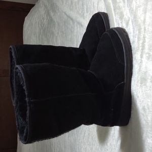 Black Tall UGG boots.